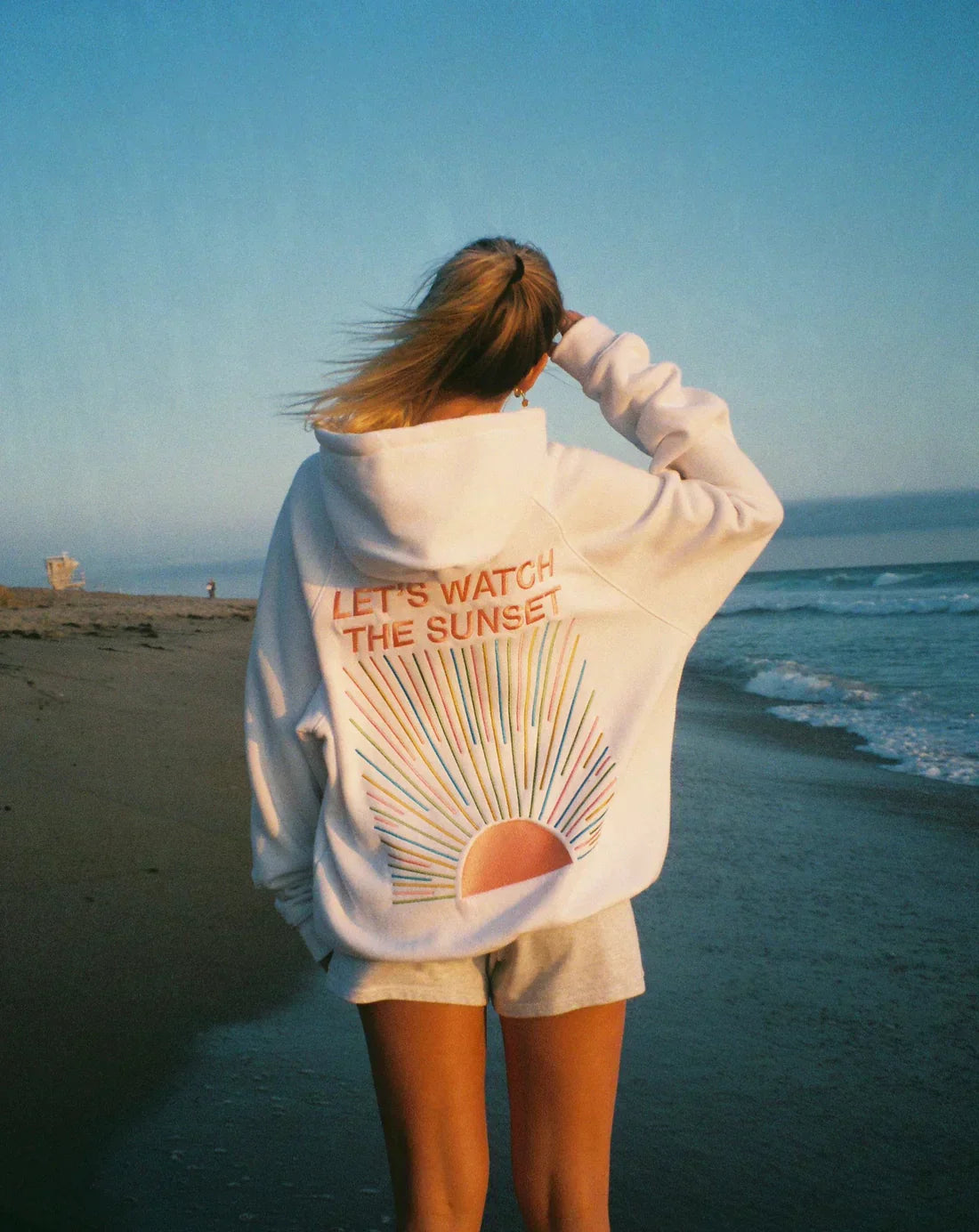 Womens white hoodie with "Let's Watch The Sunset" graphic