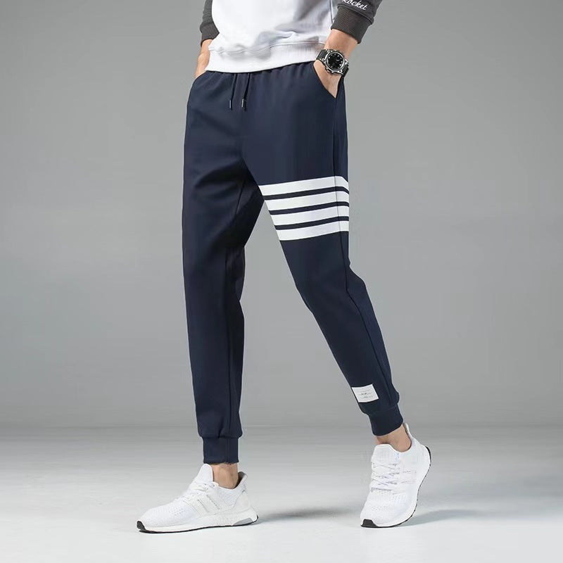 Men's casual joggers with sporty sleeve stripes