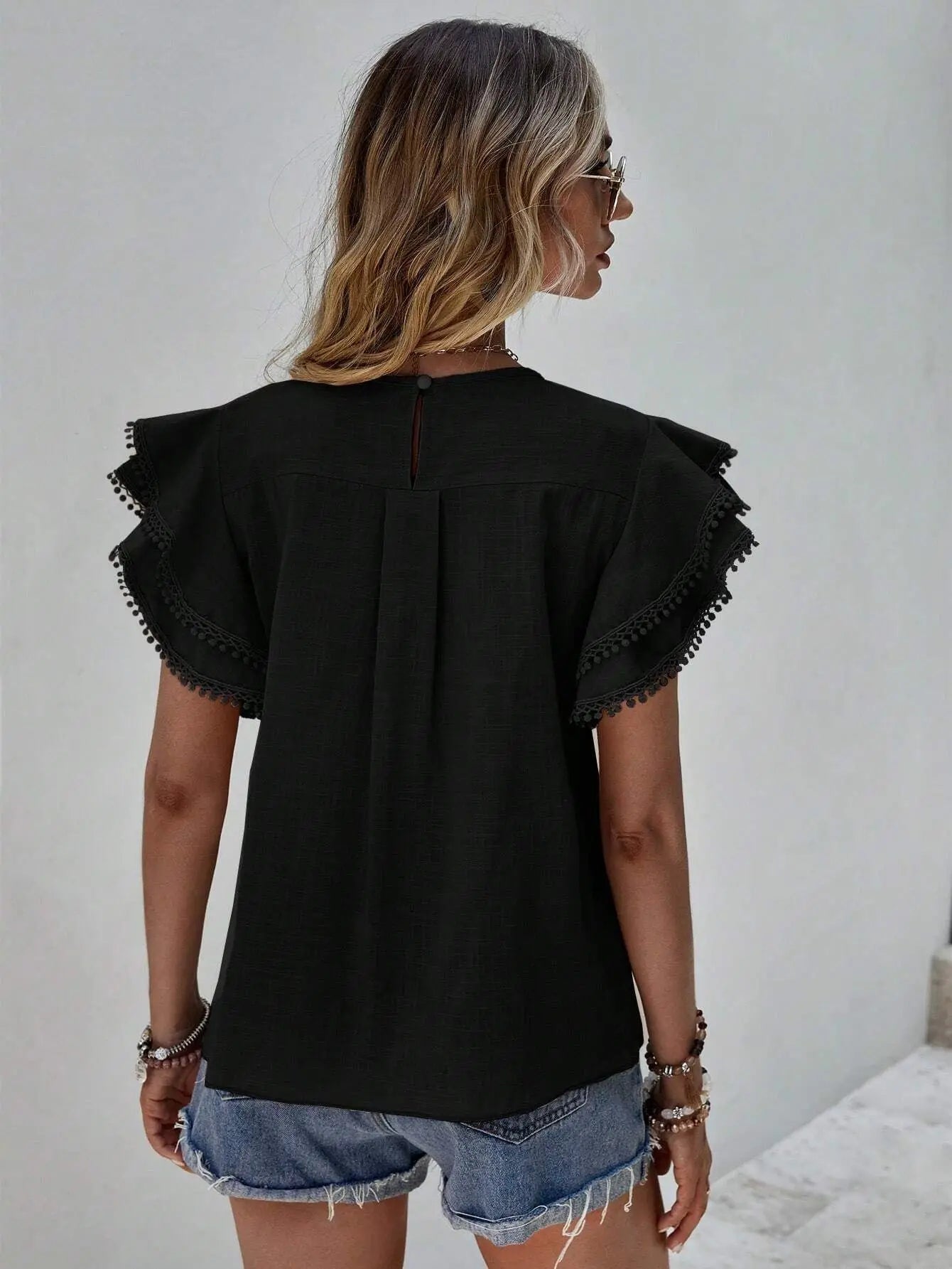 Women's ruffle sleeve top for an elegant casual loo