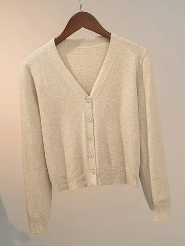 Women's knitted cardigan with V-neck and button closure