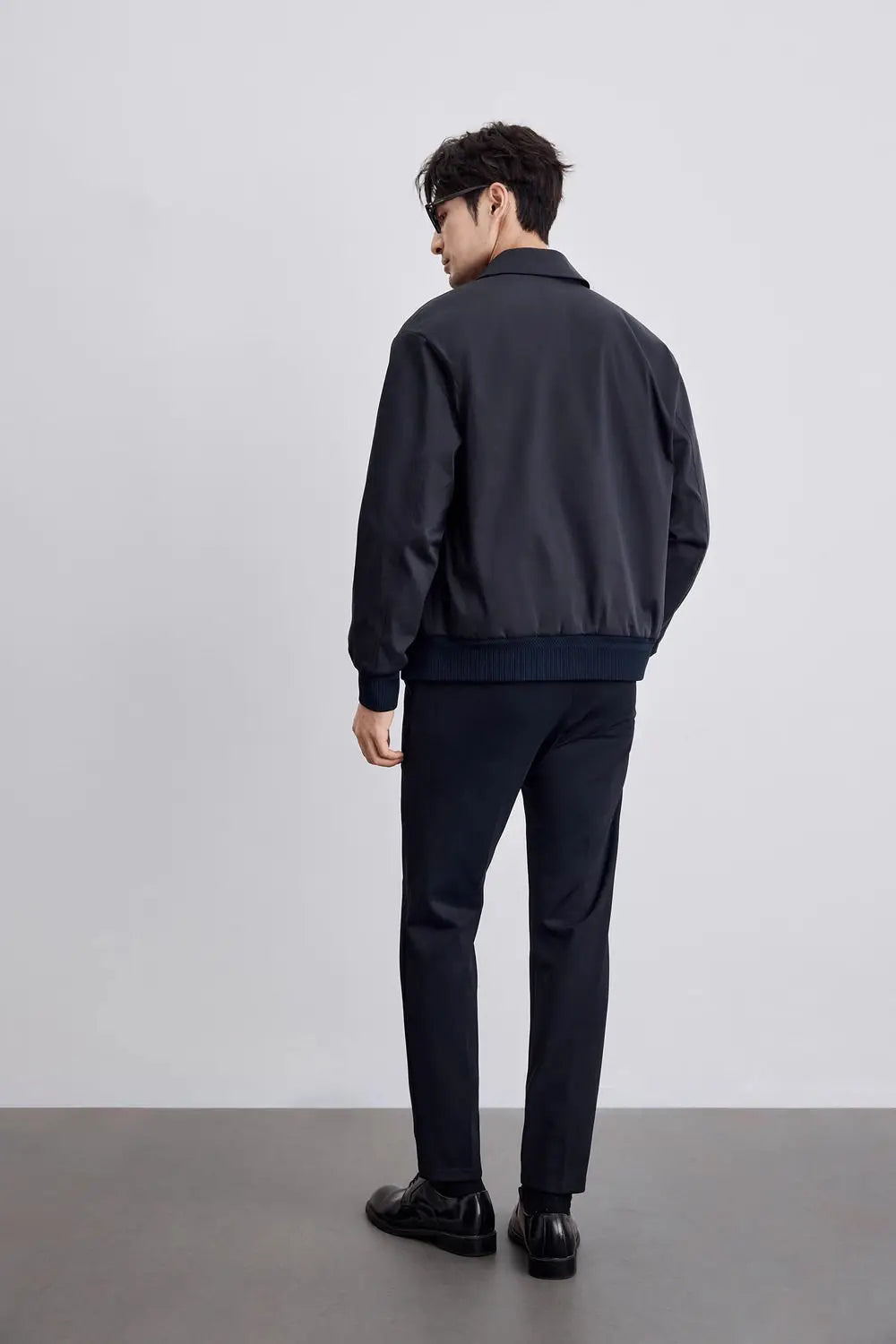 Men's minimalist black jacket for a sleek, modern look