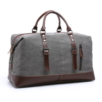 Canvas duffel travel bag with leather accents